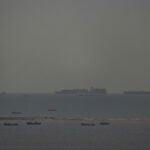 French container ship passes through the Strait of Hormuz