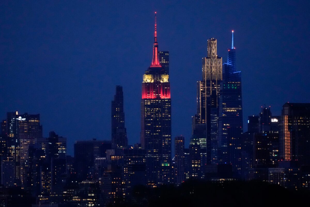 US: Two activists on top of the Empire State Building with a peace banner
